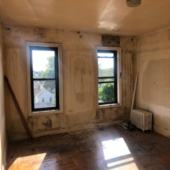 Before renovation image of a bedroom on Bay Parkway in Brooklyn, displaying the original layout and condition prior to the transformative home renovation and remodeling by Top Iconic Contractors