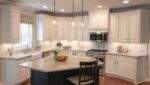 A modern kitchen with quartz countertops and stainless steel appliances, showcasing a successful kitchen remodel.